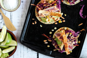 Fresh Ahi tuna fish tacos with smoky adobo crema & crunchy red cabbage coleslaw - She Eats